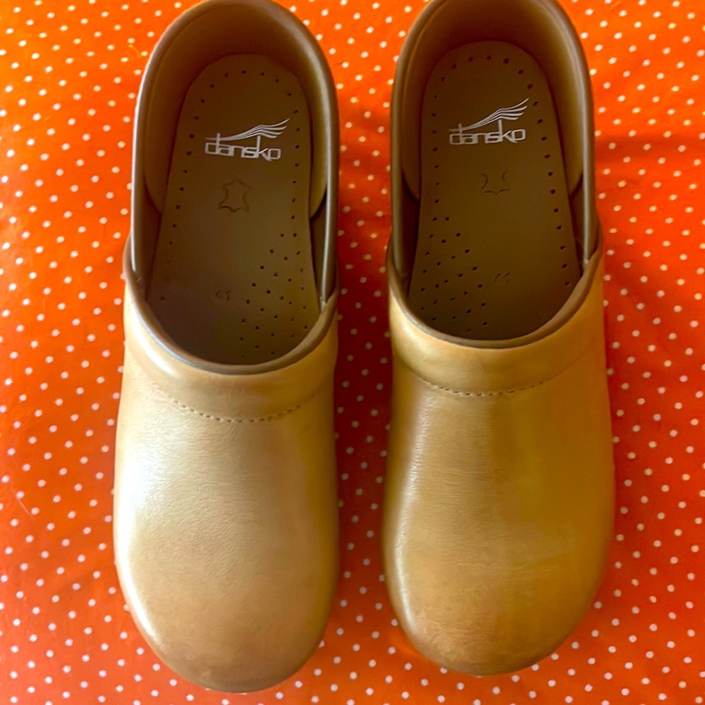 Never worn Dansko clogs. Perfect condition!!